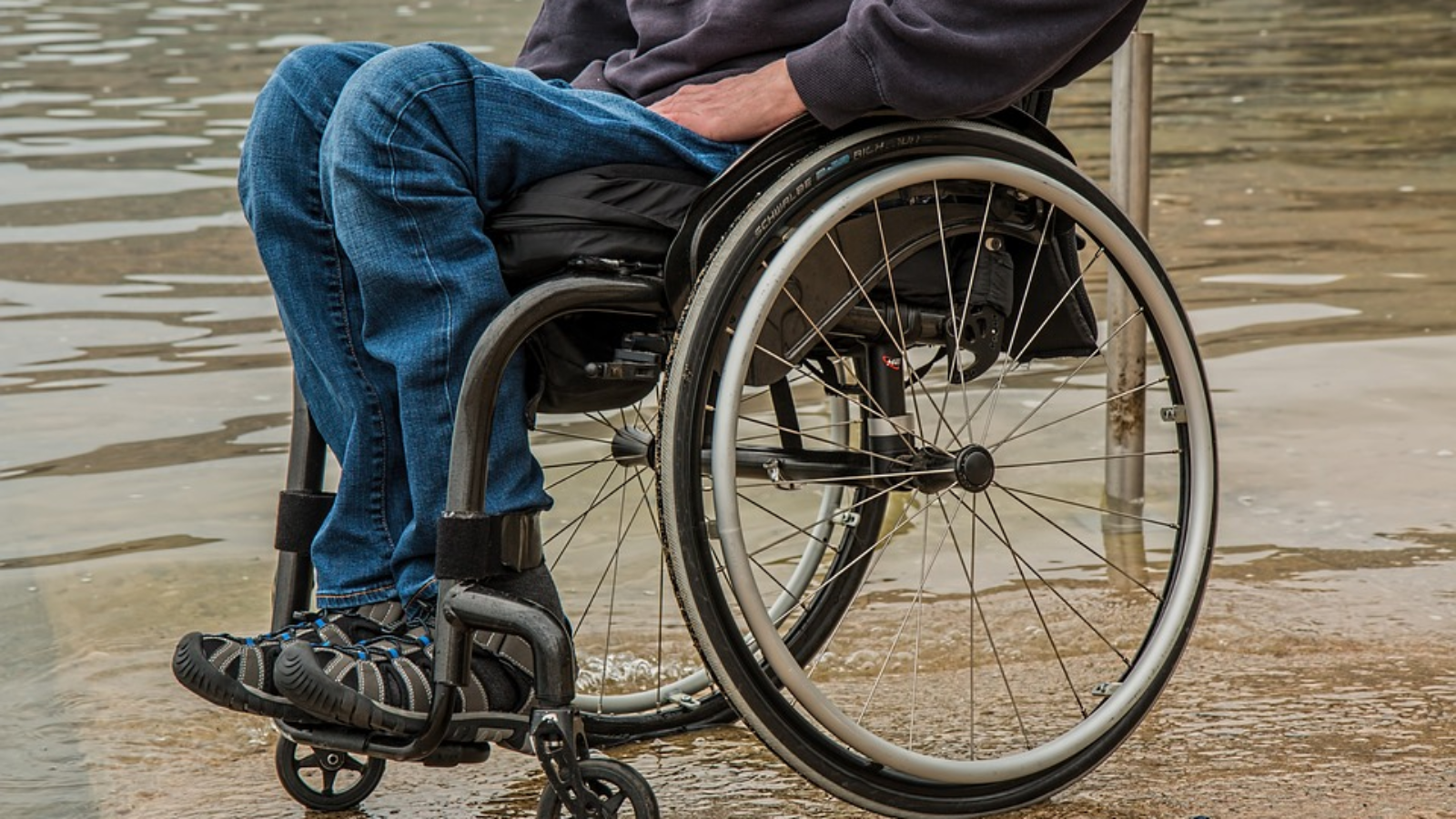 A person in a wheelchair who suffered a personal injury disability.