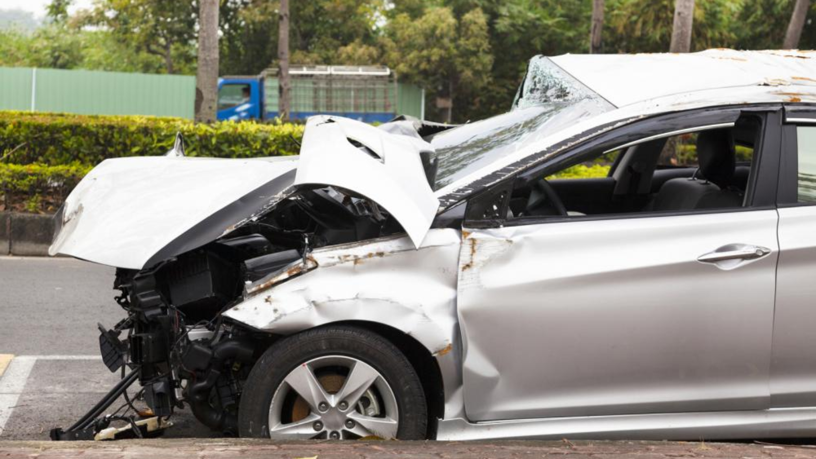 A damaged car after an accident on the road.