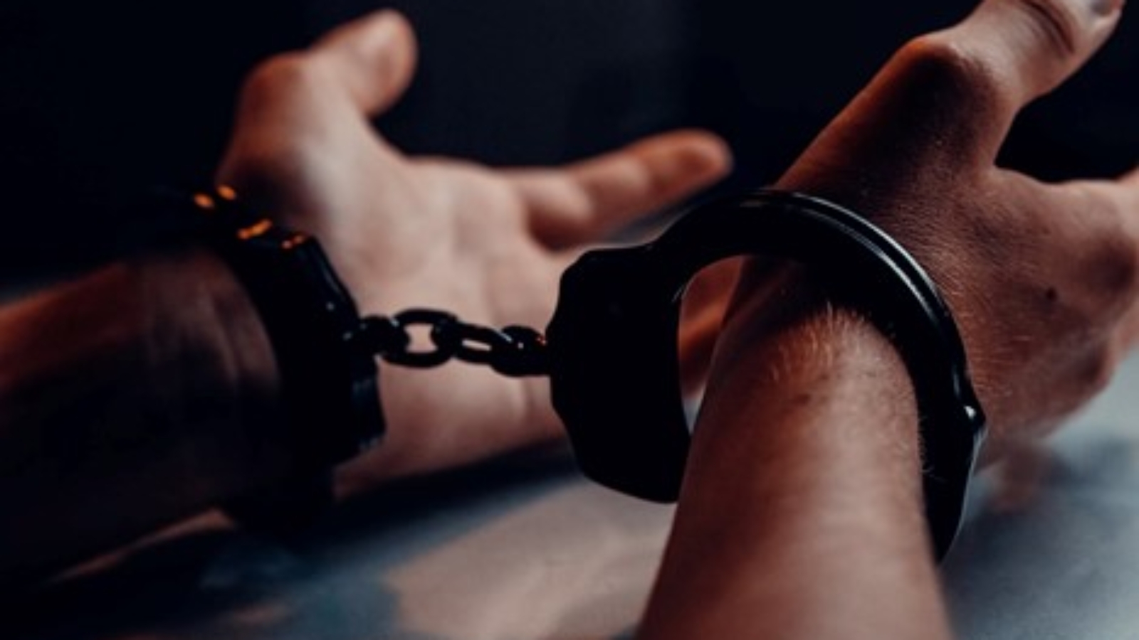 A person wearing handcuffs