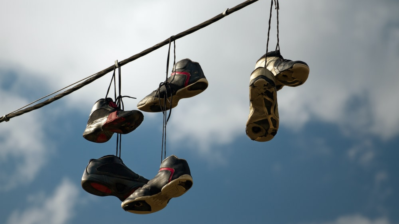 Shoes strung up to a pole as a prank